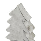 Close-up of the tree ornament's pointed top and thick curved branch edges, with grey mottling across the pale surface.