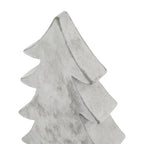 Close-up of the tree ornament's pointed top and curved branch tips, showing grey streaks and darker marks along the thick edges.