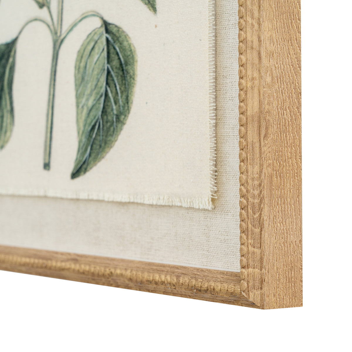 Angled close-up of the print's lower right corner, showing a green leaf, the lightly fringed edge of the image, pale woven-looking surround and beaded tan-gold frame.
