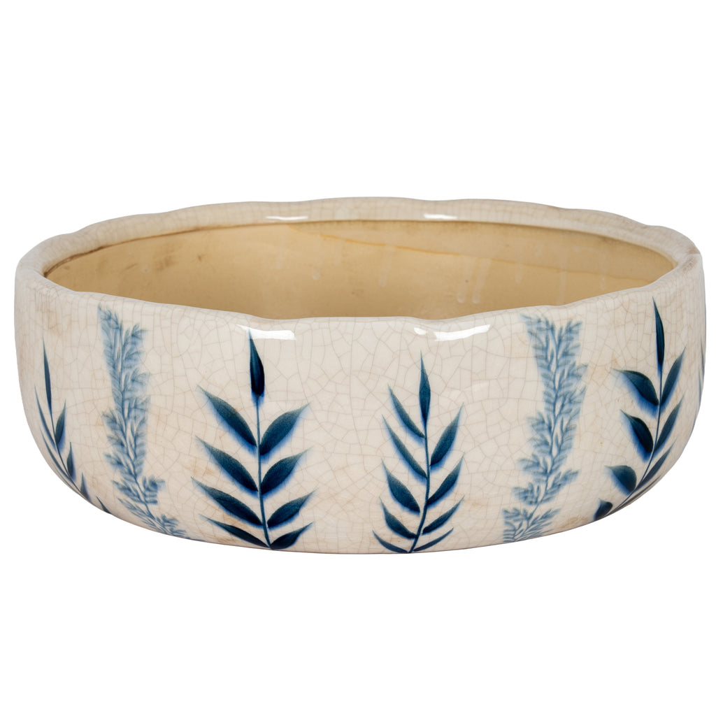 Blue leaf bowl planter viewed from the front and slightly above, showing its broad curved sides, wavy rim and beige interior.