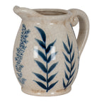 Blue leaf jug-form vase on a white background, showing its rounded body, loop handle, projecting lip and short footed base.