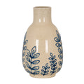 Blue Leafoutline vase on a white background, showing its open cylindrical neck, rounded body and blue leafy stems over a pale brown-speckled surface.