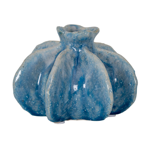 Blue vase on a white background, showing rounded lobes, deep vertical recesses and a short neck with a wavy rim.