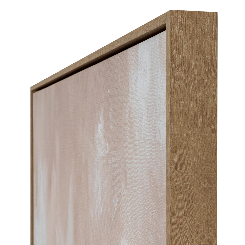 Angled close-up of the top right corner, showing the grain of the natural wood-effect frame beside pale blush and white canvas.
