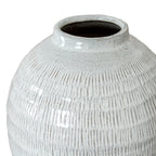 Angled close-up of the vase opening and rounded shoulders, showing the glossy speckled rim and fine vertical grooves.