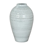 Pale blue-white vase shown in full against white, with rounded shoulders, an incised upper band and a tapered lower body.