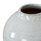 Angled close-up into the vase opening, showing the rounded rim, dark interior and speckled glossy glaze across the neck and shoulder.