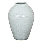 Pale blue-white speckled vase with a short open neck, rounded shoulders, an incised upper band and a tapered body against a white background.