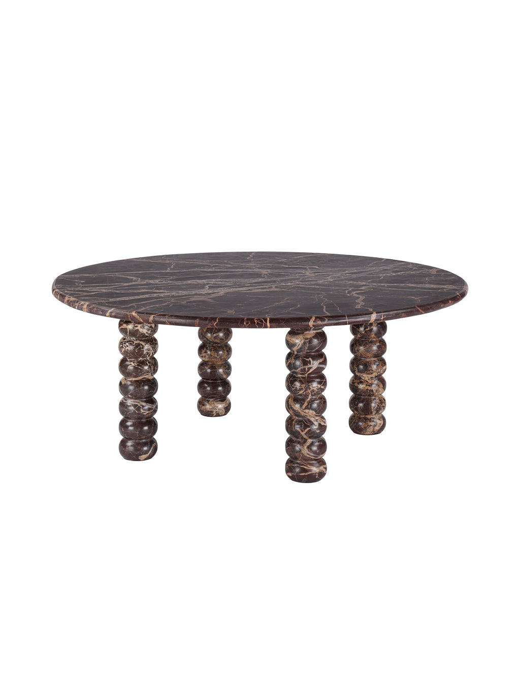 Angled view of a round burgundy marble coffee table with cream veining and four bobbin-shaped legs on a white background.