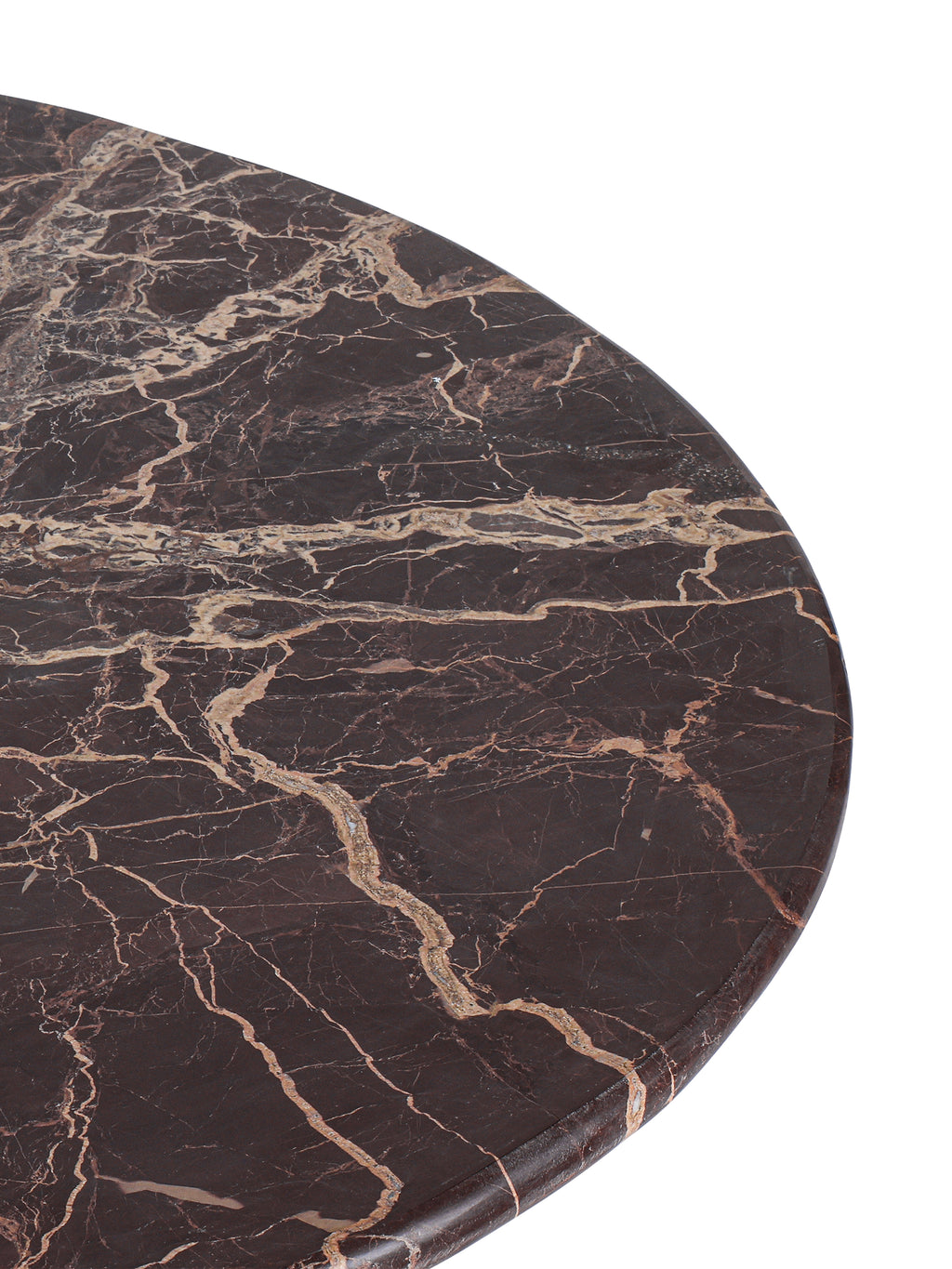 Close-up of the marble tabletop with pale irregular veining and a softly rounded outer edge.