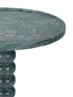 Detail of the marble tabletop's shallow rim and veining above the polished curves of the bobbin pedestal.