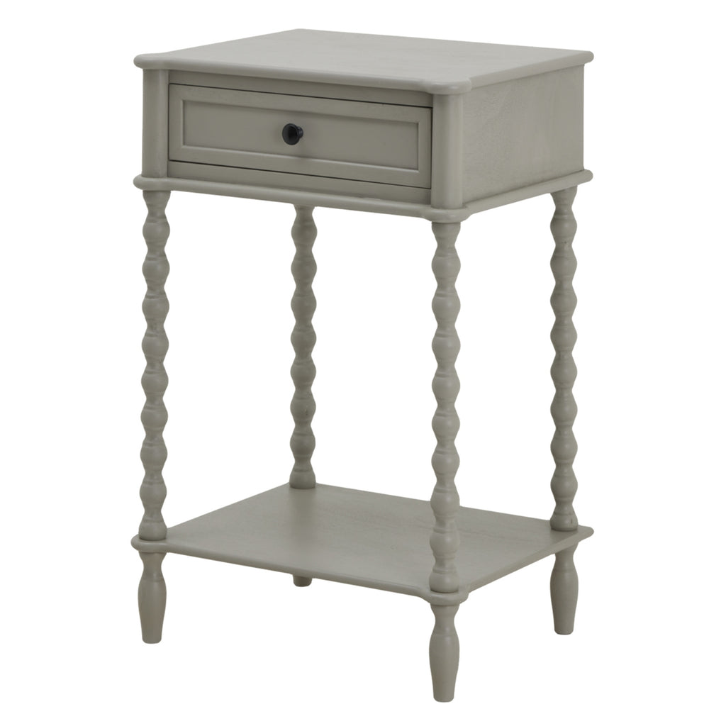Pale grey side table shown at an angle, with a framed drawer, dark round knob, four bobbin legs and a rectangular lower shelf.