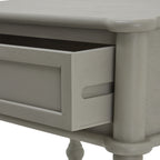 Close view of the partly open drawer, showing its dark interior, recessed horizontal groove on the side and pale grey grain texture.