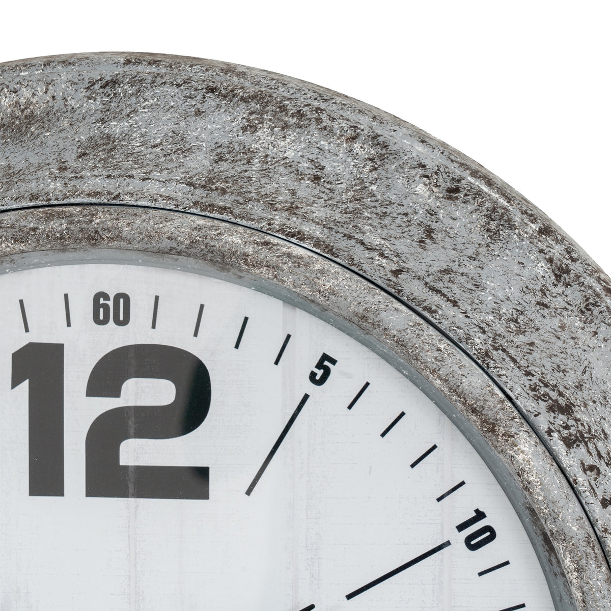 Close-up of the clock's mottled silver-grey rim above the large black twelve and smaller numbered minute markings.
