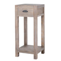 Three-quarter view of the pale-brown Border & Cup side table, showing its drawer, dark cup pull, straight legs and low shelf.