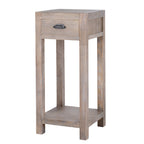 Three-quarter view of the pale-brown Border & Cup side table, showing its drawer, dark cup pull, straight legs and low shelf.