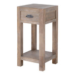 Angled view of the pale brown Border & Cup side table with a closed drawer, dark cup pull and low shelf.