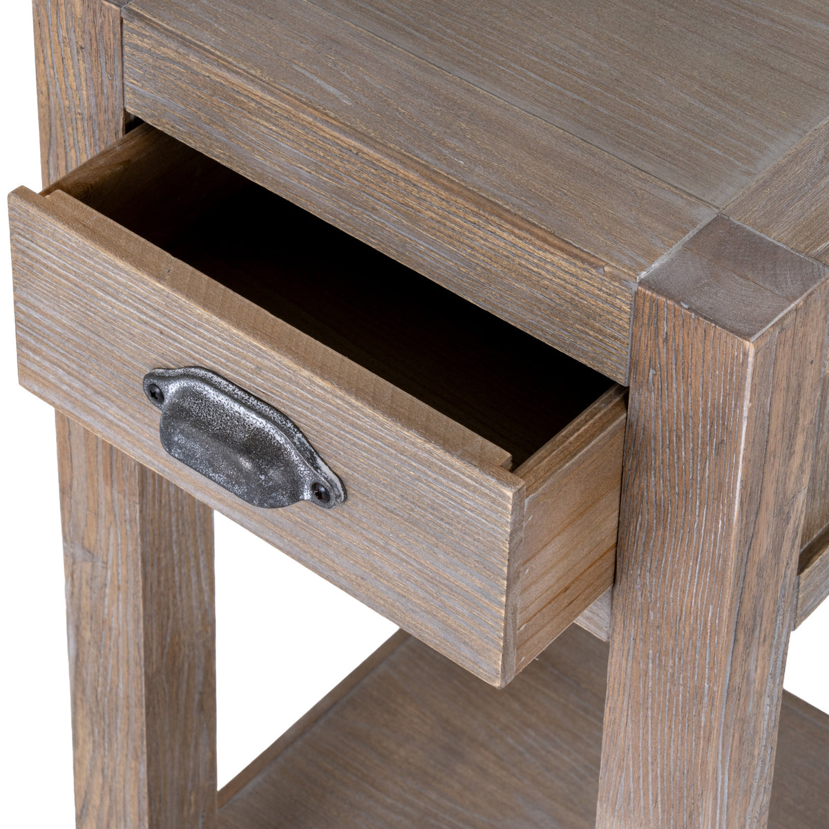 Close view of the drawer pulled open beneath the bordered top, with a dark mottled cup pull on the pale grain front.