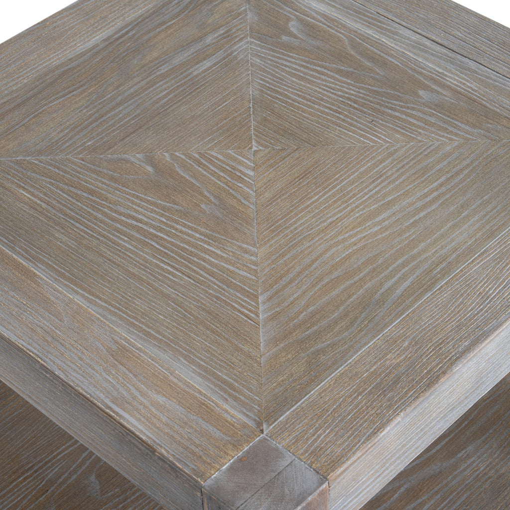 Detail of the framed tabletop with four inset grain panels meeting at the centre.