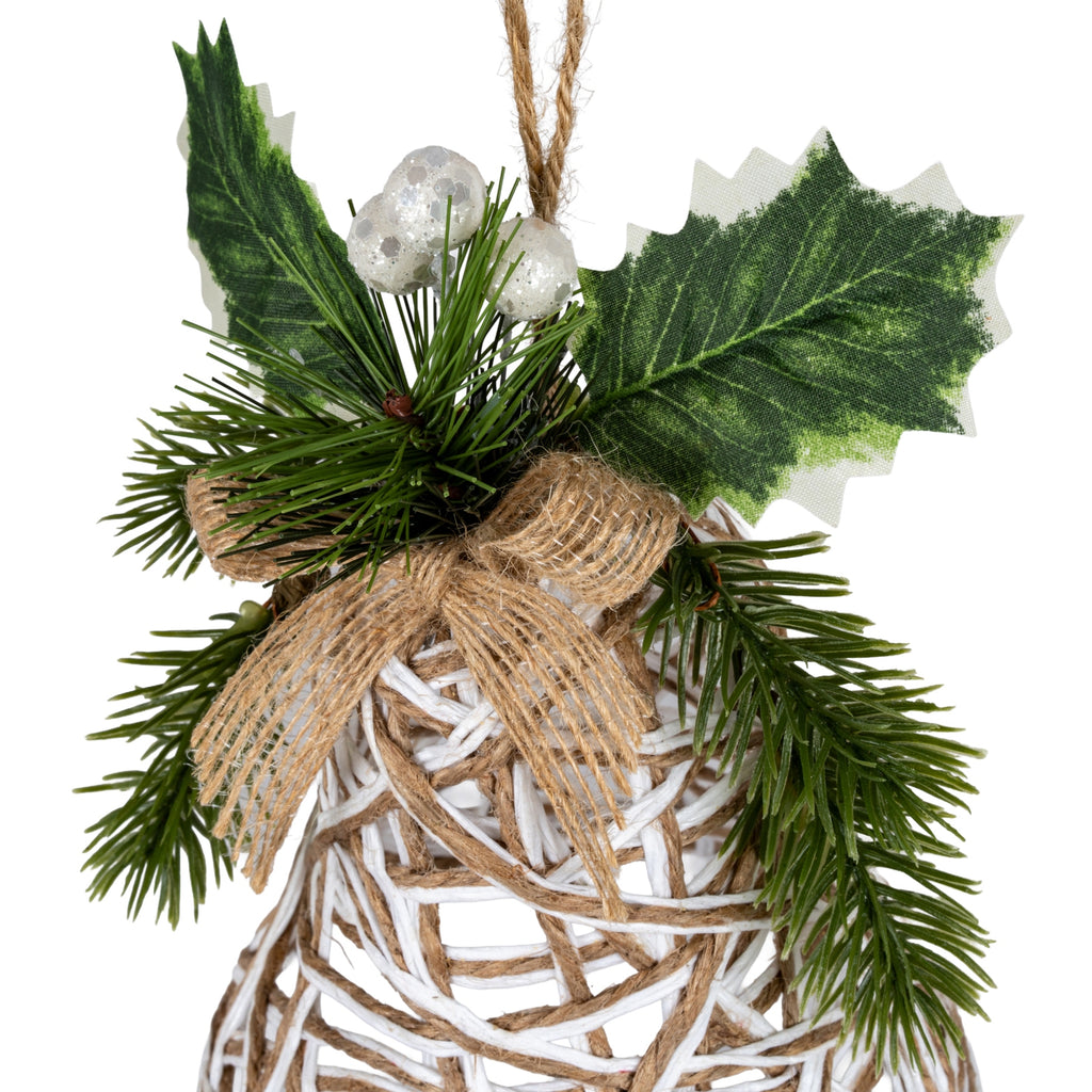Close-up of the bell decoration showing the coarse open-weave tan bow, glittery white berries, printed green holly leaves and crossing white and tan strands.