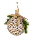 White-and-tan open lattice bauble with a tan hanging loop and bow, green pine sprays, white berries and a white-tipped pinecone on a white background.
