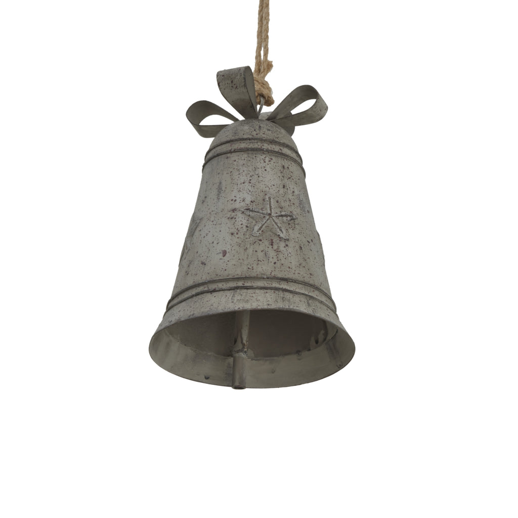 Close view from below of the star-decorated grey bell, showing its flared opening, internal clapper, raised bands and open bow loops.