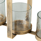 Close-up of a hammered-glass holder resting in its mottled gold-toned circular base beside the metal frame.
