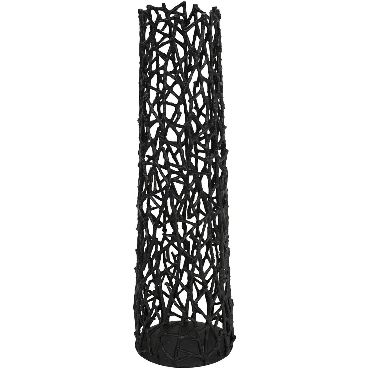 Black openwork sculpture against white, showing overlapping branch forms and an uneven top edge.