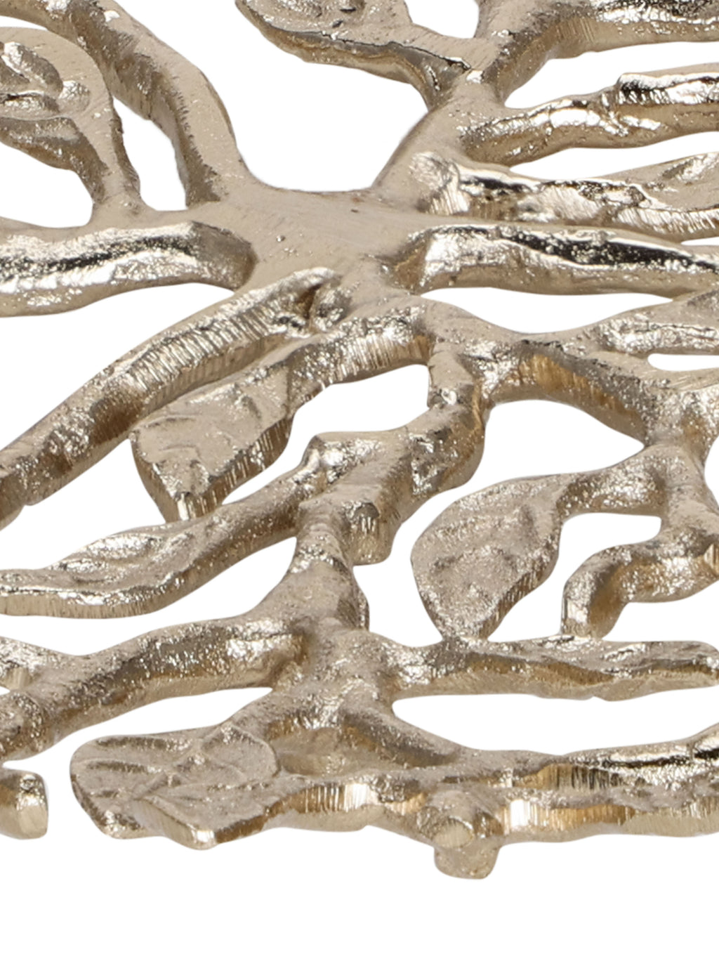 Detail of the platter's central branching stems, textured metal surface and open spaces between leaves.