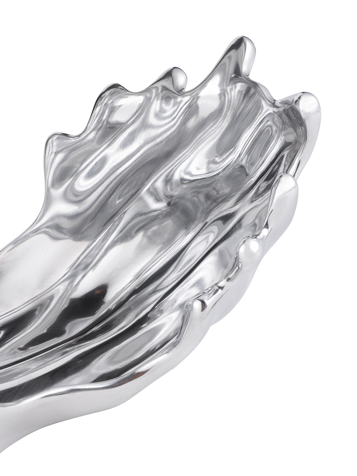 Close-up of the wave sculpture's lower section, with a rippled silver surface and rounded, uneven edge.