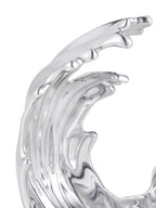 Close-up of the tall wave crest, showing curved ridges and rounded tips in polished silver.