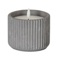 Unlit grey ribbed LED candle with a pale inset top and white flame-shaped centre against a white background.