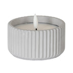 Small LED candle with pale grey ribbed sides, a recessed pale top and a white flame-shaped centre against a white background.