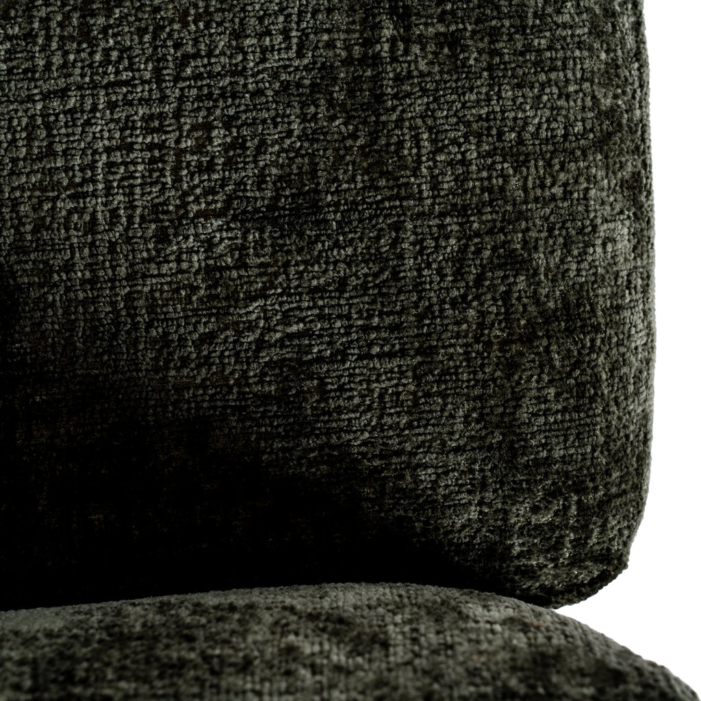 Close-up of the chair's back and seat cushions showing the dense olive-green surface texture and rounded cushion edge.