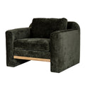 Three-quarter front view of a dark olive-green armchair with broad rounded arms, seat and back cushions, and a pale brown front rail.