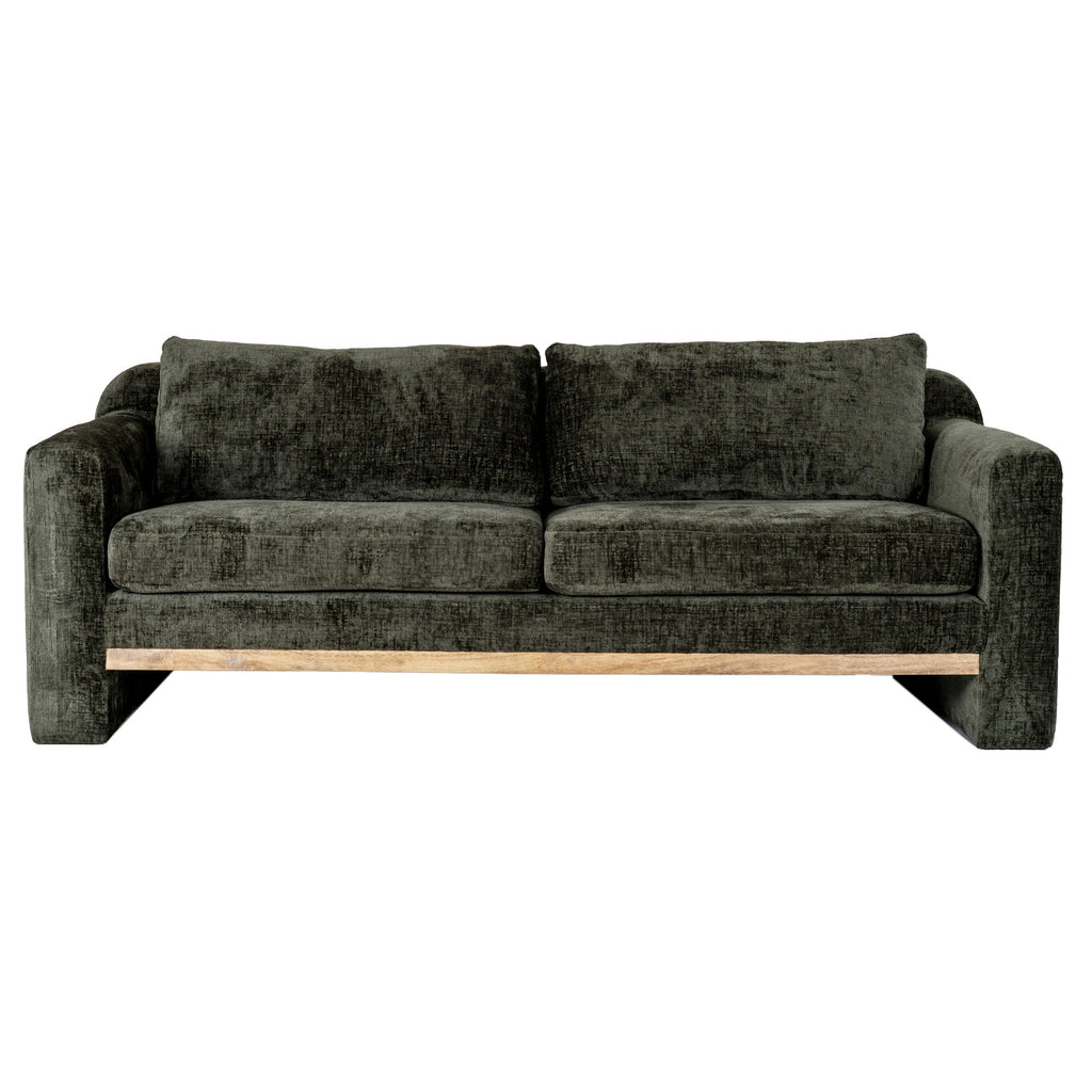 Straight-on view of the olive-green sofa with two seat cushions, two back cushions and a pale brown rail beneath the seat.