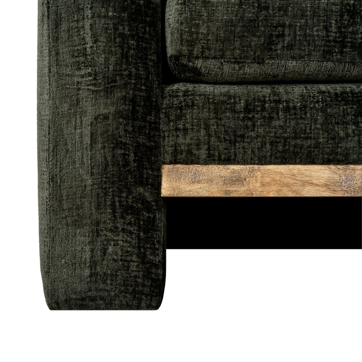 Detail of the sofa's lower front corner where the pale brown rail meets the olive-green arm beneath the seat cushion.