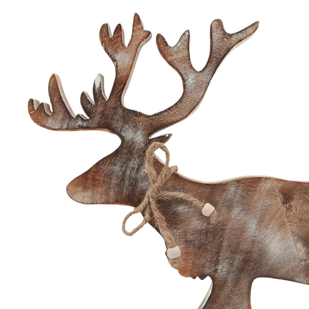 Close-up of the stag's head and branching antlers with streaked brown and pale colouring and a loose cord bow at the neck.