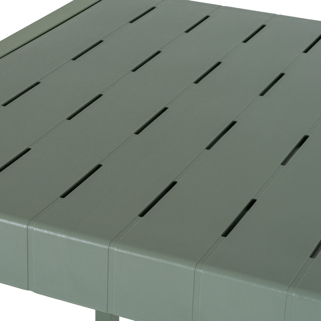 Close-up of the green-grey tabletop with broad parallel slats, staggered narrow slots and a fine linear texture.