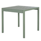 Green-grey dining table viewed at an angle, showing its broad slatted top, thick frame and four straight square legs.