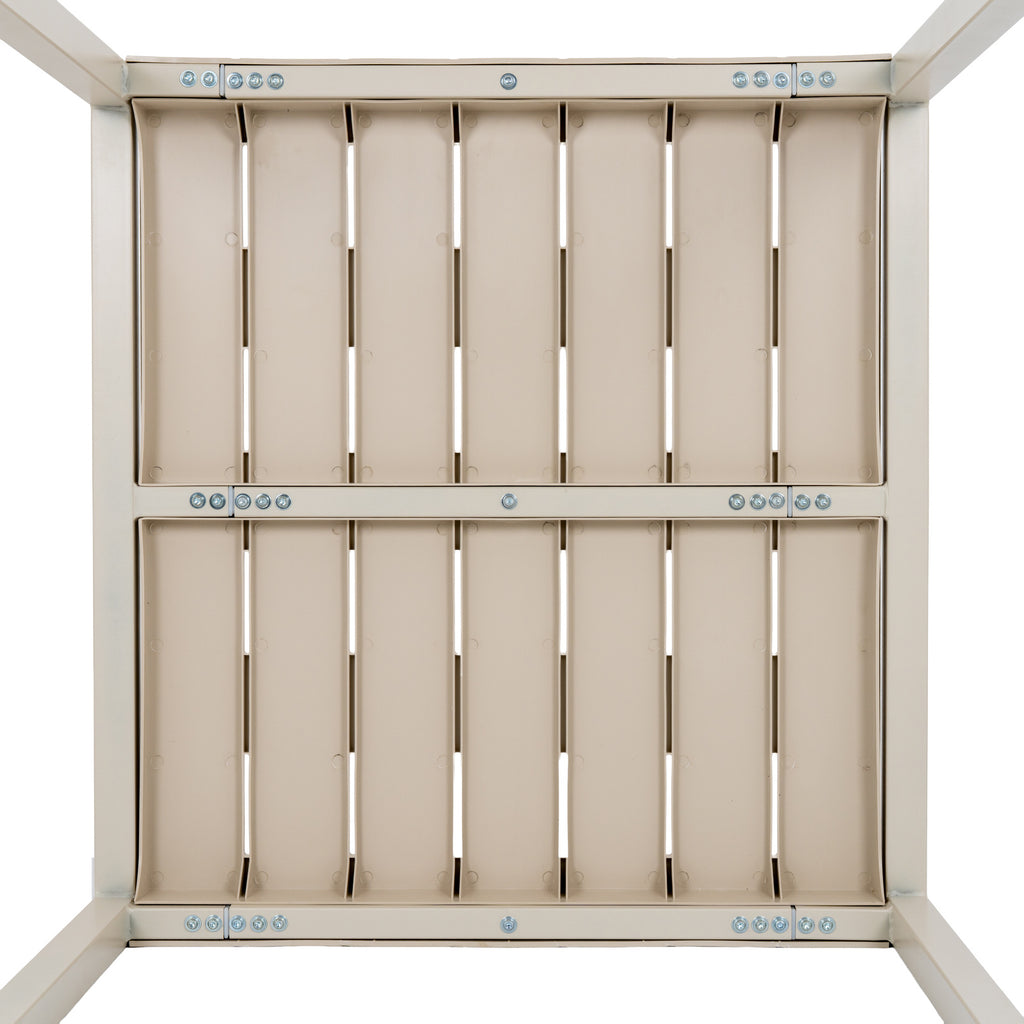 Underside of the putty table, showing repeated rectangular recesses, narrow openings and rows of visible silver-coloured fixings.