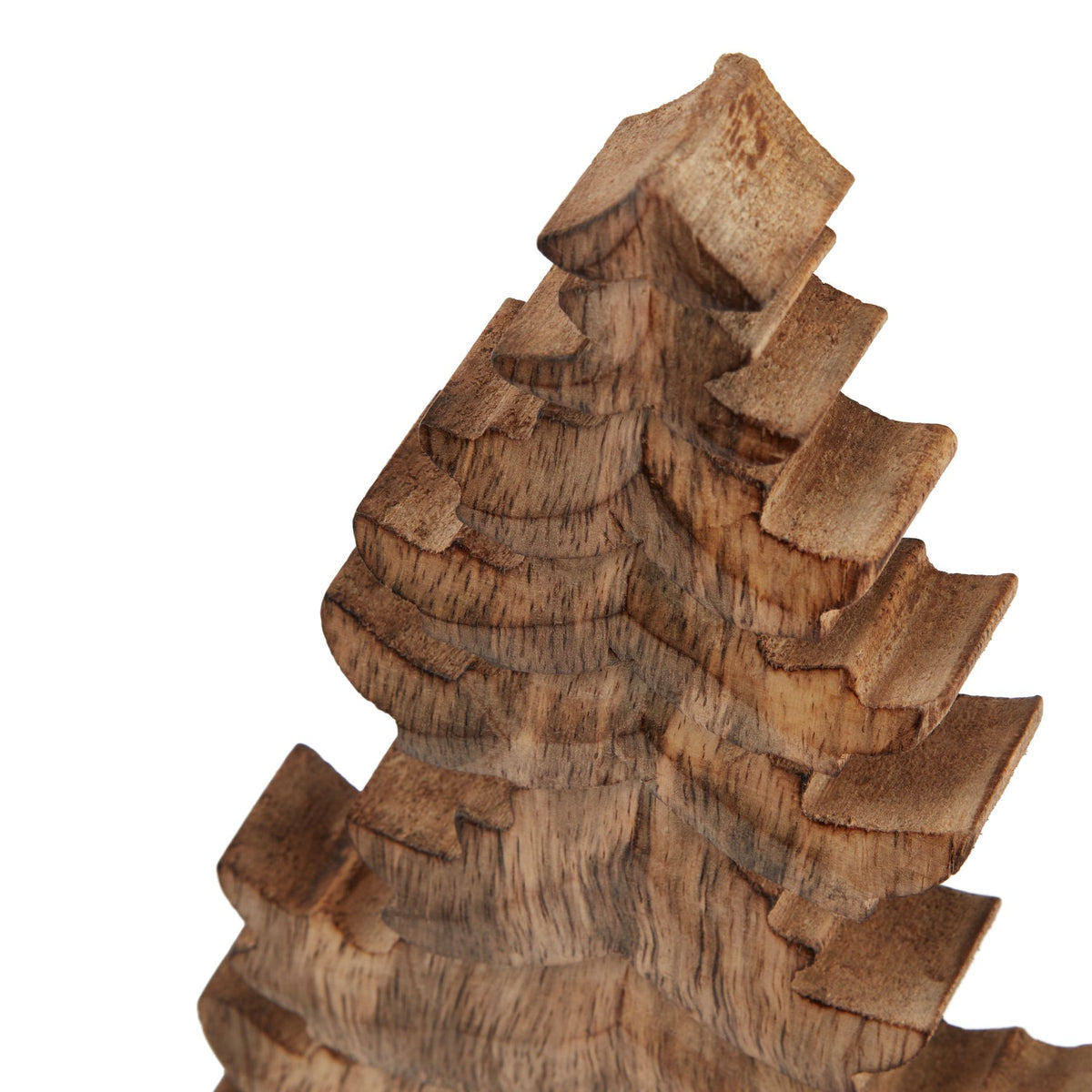 Close-up of the tree ornament's pointed top and stepped upper branches, showing dark grain lines across the brown surface.