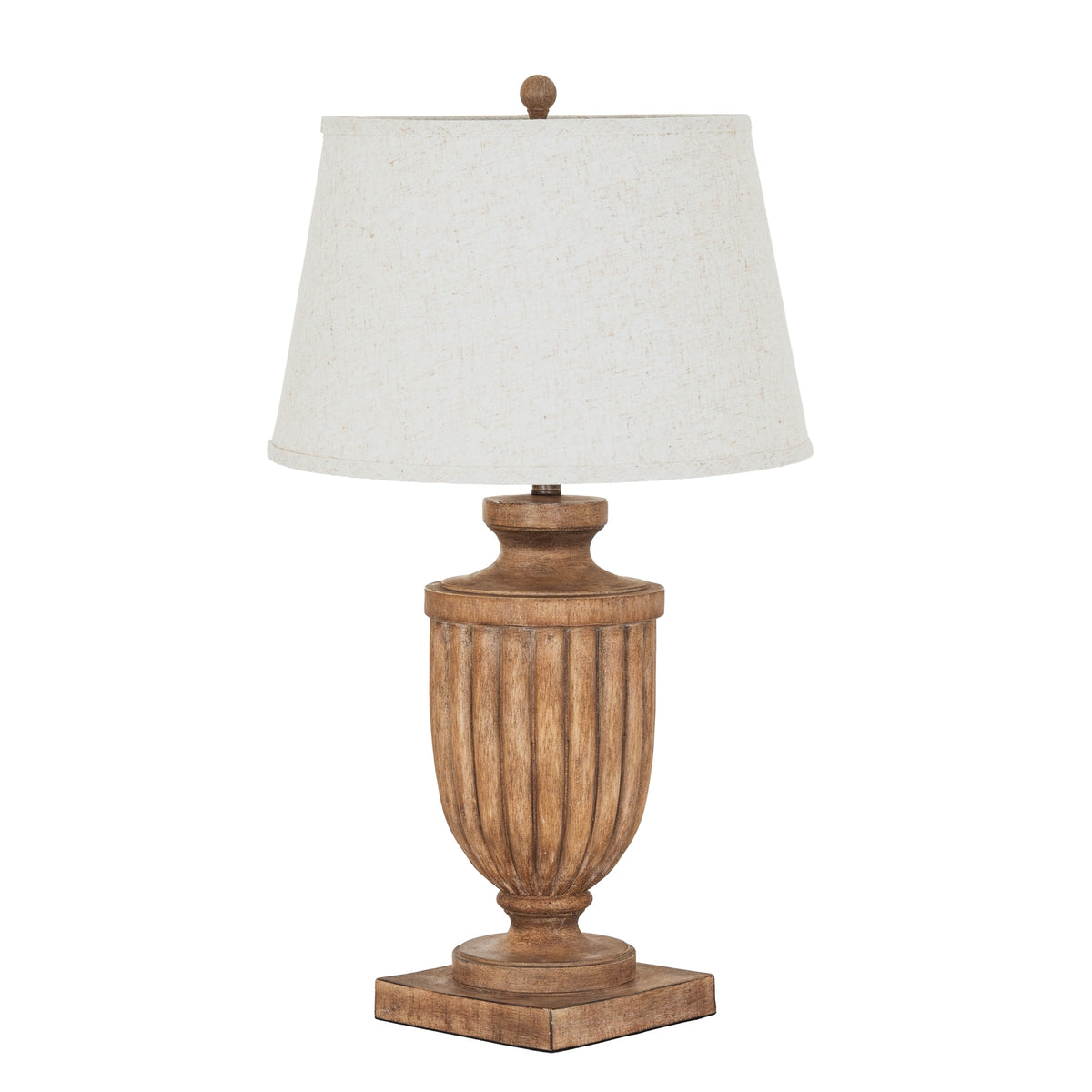 Brown table lamp with a fluted urn-shaped body, square plinth, pale tapered shade and round finial against a white background.