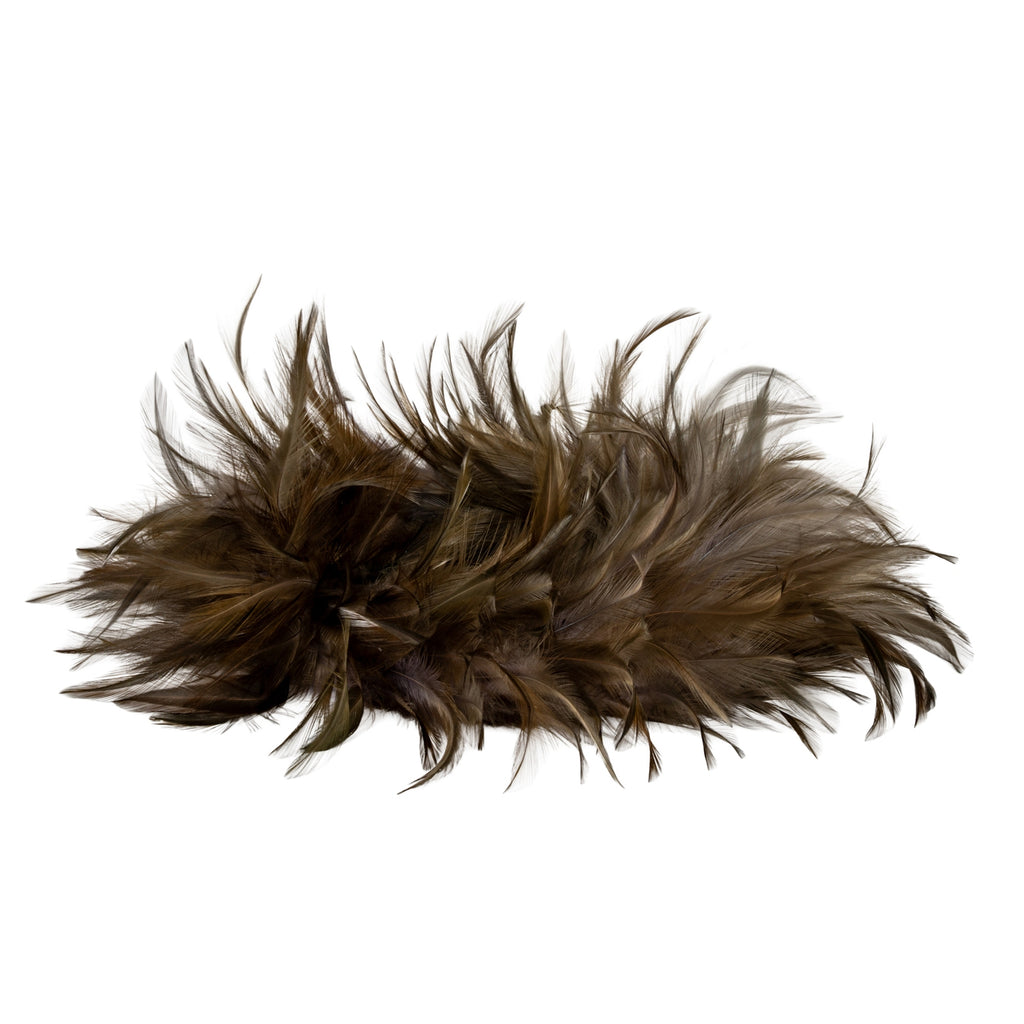 Low side view of the brown decorative ring, showing its layered profile and wispy feather-like outline against white.