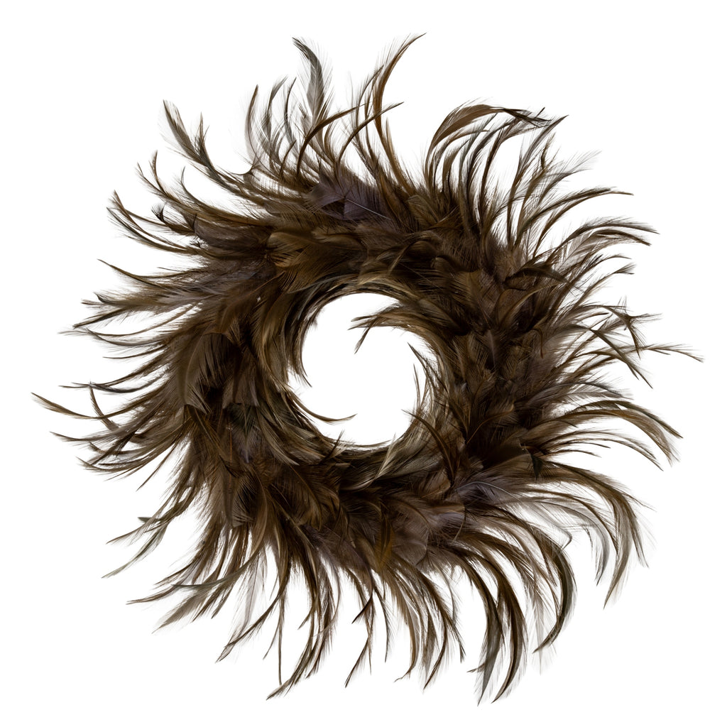 Full view of a brown decorative ring with an open centre and long feather-like tips spreading around its edge.