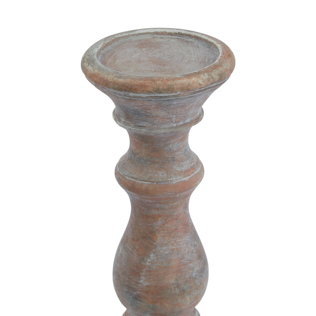 Close view of the candle holder's shallow dish and upper stem, showing the rounded rim and pale distressed markings over the brown finish.