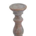 Close view of the candle holder's shallow dish and upper stem, showing the rounded rim and pale distressed markings over the brown finish.