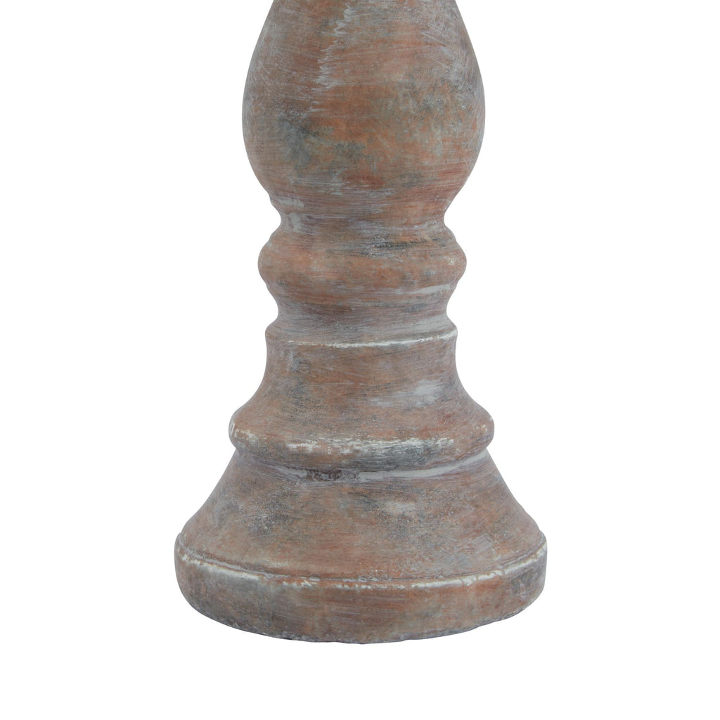 Detail of the candle holder's lower stem and stepped foot, with ring contours and grey-white markings across the brown surface.