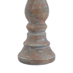 Detail of the candle holder's lower stem and stepped foot, with ring contours and grey-white markings across the brown surface.