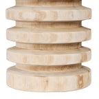 Close-up of the vase's lower ribs, showing fine brown grain on pale bands and deeper shaded recesses.
